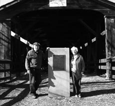 Jean and Rosener Wheeler flank the dedication monument at Perrine's Bridge in February 2006.